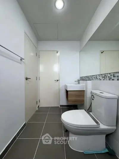 Modern bathroom with sleek fixtures and stylish tile flooring