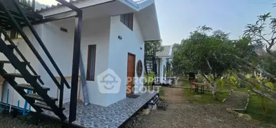 Charming modern house with unique circular window and lush garden setting