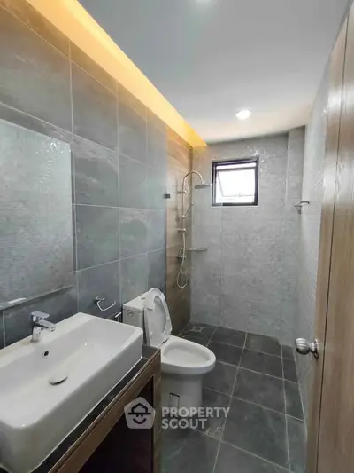 Modern bathroom with sleek design and spacious shower area