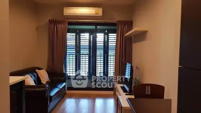 Cozy living room with modern furniture and large windows