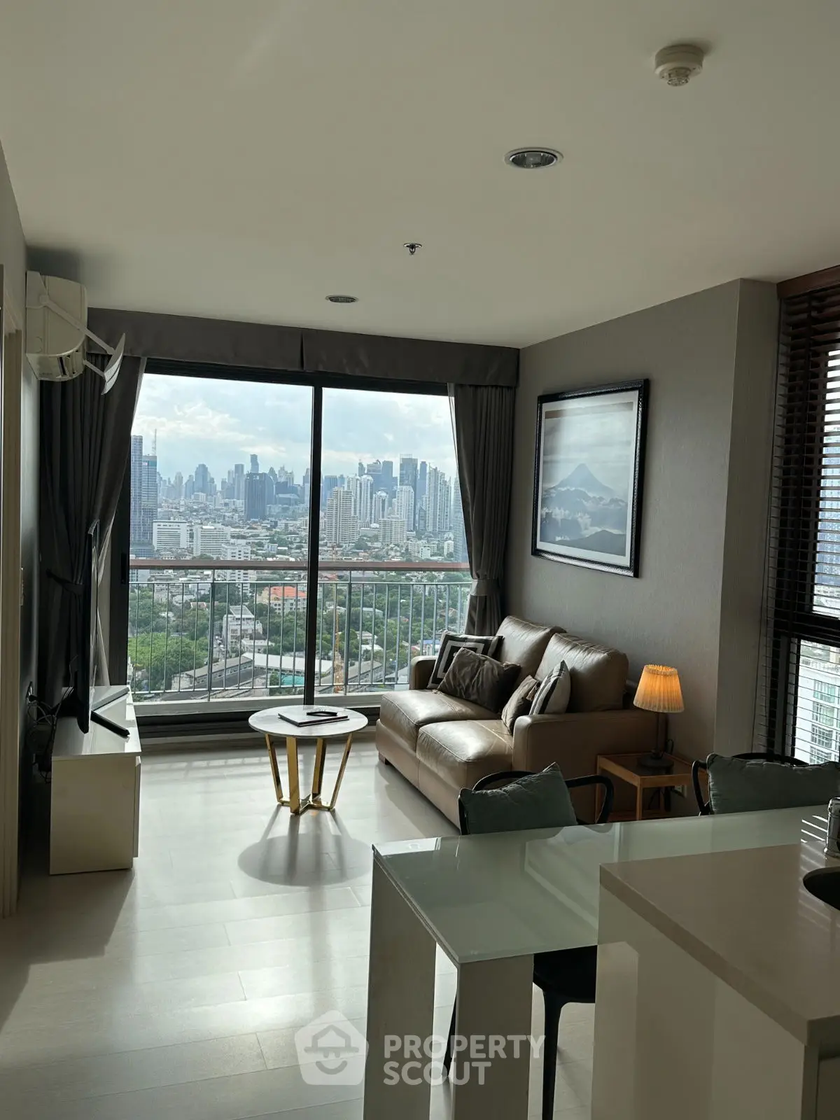 Modern living room with stunning city view and stylish decor