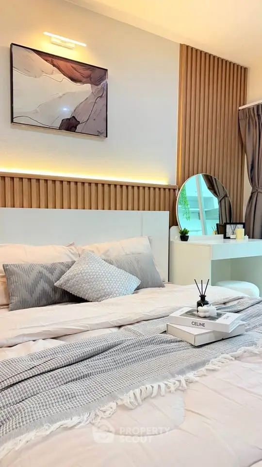 Modern bedroom with stylish decor and cozy ambiance, featuring elegant lighting and contemporary furnishings.