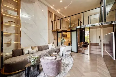 Luxurious modern living room with high ceilings and elegant decor