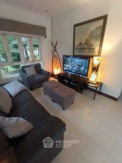 Cozy living room with modern decor and large window view