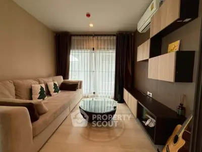 Modern living room with cozy sofa, stylish shelves, and large window for natural light.