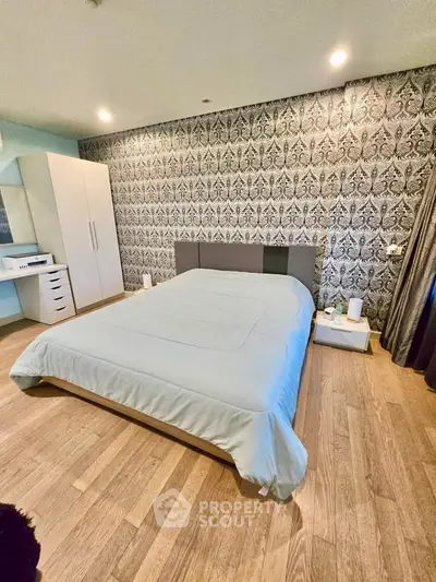 Luxurious bedroom with elegant wallpaper and modern furnishings