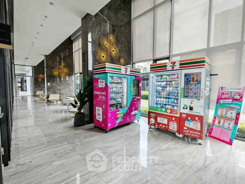 Modern building lobby with vending machines and stylish decor