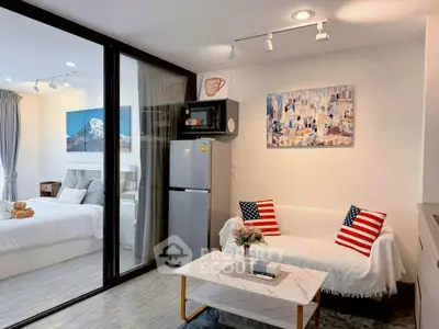 Modern studio apartment with cozy living area and stylish decor