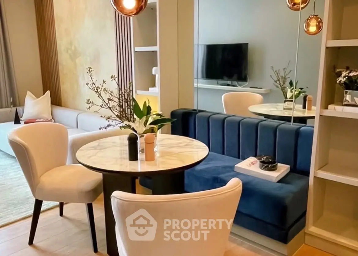 Stylish modern living room with elegant dining area and plush seating