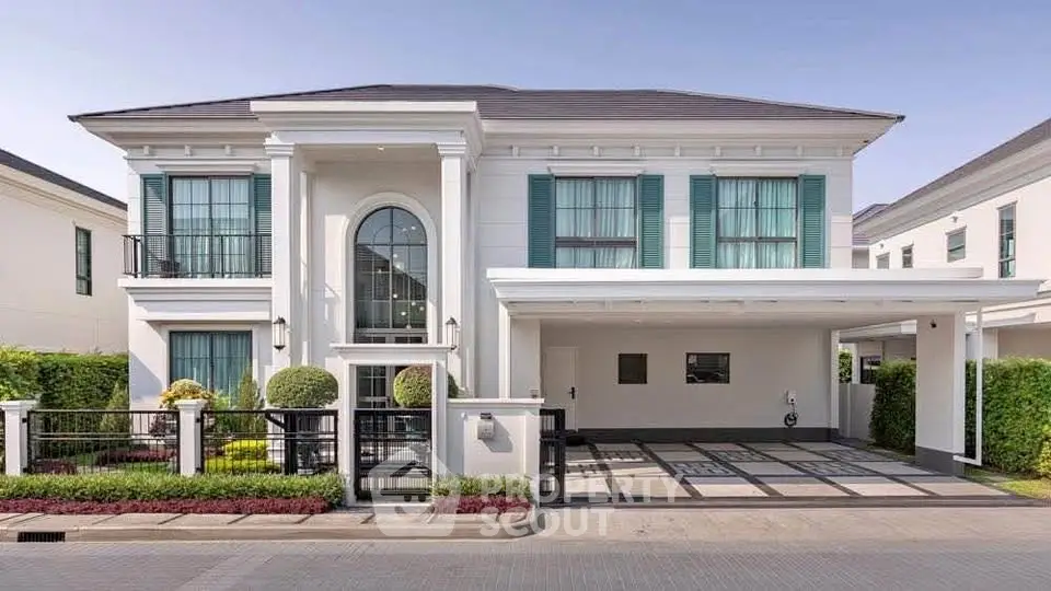 Elegant two-story house with modern architecture and spacious driveway in a serene neighborhood.