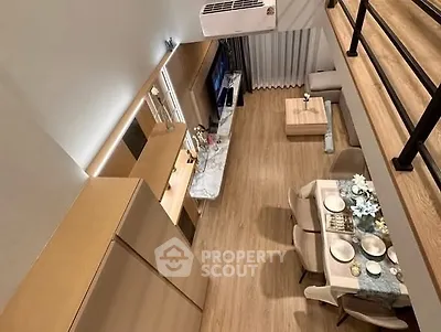 Modern loft-style living room with dining area and stylish decor