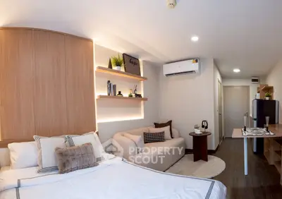 Modern studio apartment with cozy living area and stylish decor