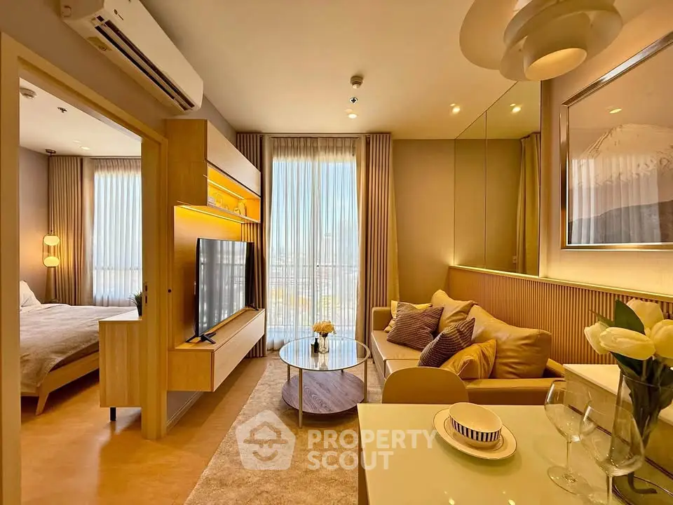 Modern living room with elegant decor and natural light in a stylish apartment.