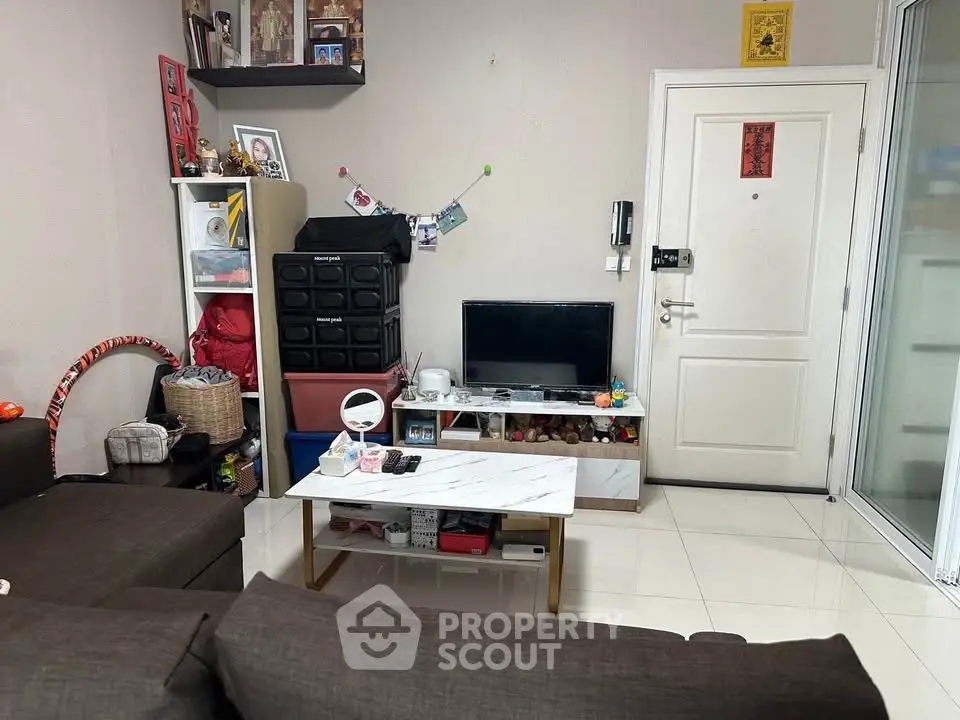 Cozy living room with modern decor and ample storage space, perfect for urban living.