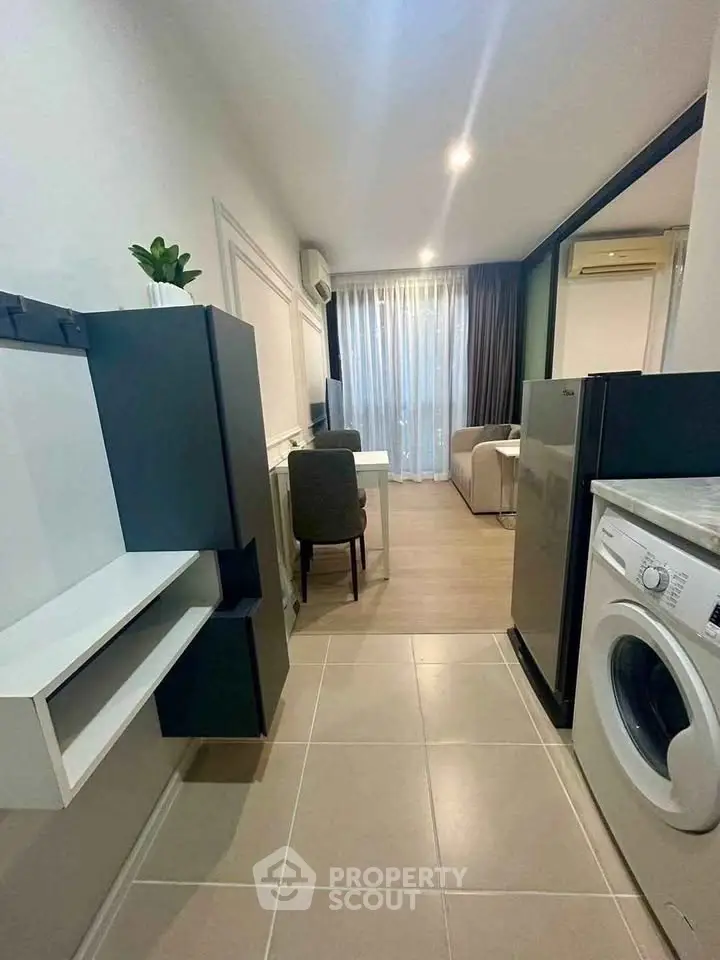 Modern compact apartment with washing machine and stylish decor