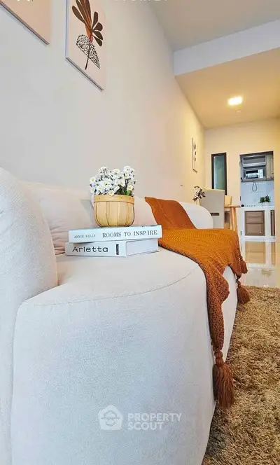 Stylish modern living room with cozy sofa and elegant decor in a contemporary apartment.