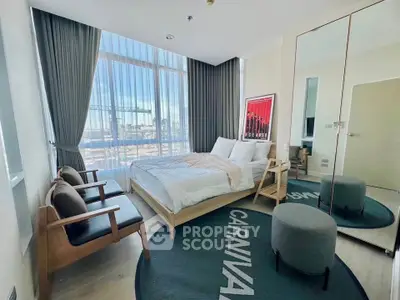 Modern bedroom with floor-to-ceiling windows and stylish decor in a high-rise apartment.