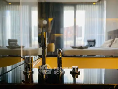 Luxurious bathroom with modern fixtures and a view into a stylish bedroom.