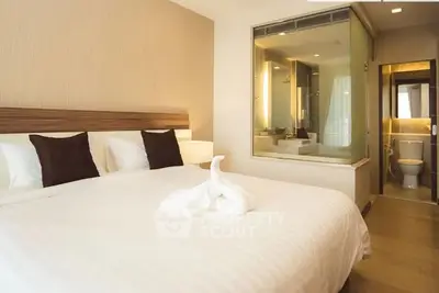 Luxurious bedroom with ensuite bathroom featuring modern design and elegant decor.