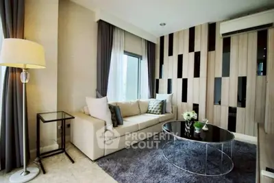 Modern living room with stylish decor and large windows