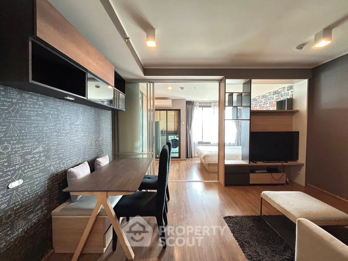 Modern open-plan living room with stylish decor and natural light