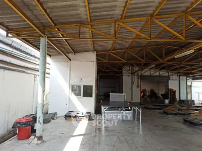 Spacious industrial warehouse with high ceilings and ample natural light