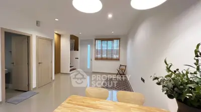 Modern minimalist interior with wooden accents and bright lighting