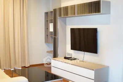 Modern living room with sleek TV unit and stylish shelving
