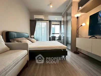 Modern bedroom with stylish decor and large window view