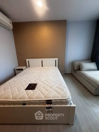 Modern bedroom with stylish decor and comfortable furnishings for a cozy living experience.