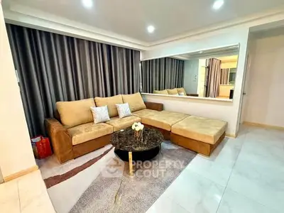 Spacious living room with modern sectional sofa and elegant decor