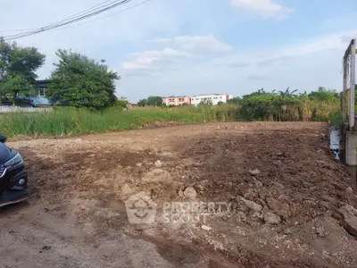 Vacant land plot ready for development in a serene suburban area with lush greenery.