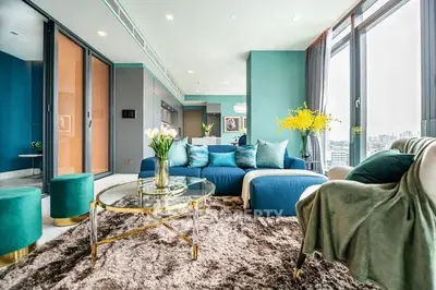 Luxurious modern living room with plush furnishings and city view, perfect for stylish urban living.