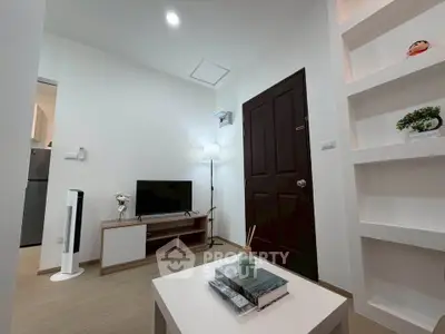 Modern living room with minimalist decor and built-in shelving