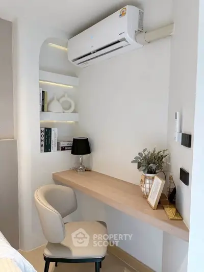 Modern study nook with built-in desk, chair, and air conditioning in a cozy corner.