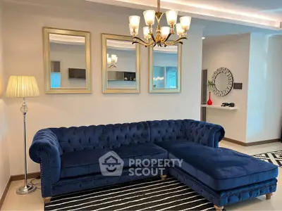 Elegant living room with plush blue sectional sofa and stylish decor