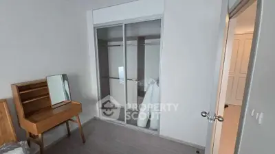 Modern bedroom with sliding closet doors and stylish wooden furniture