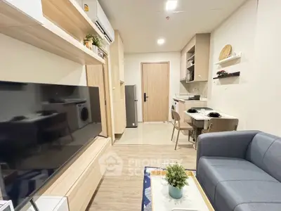 Modern living room with open kitchen layout and stylish decor