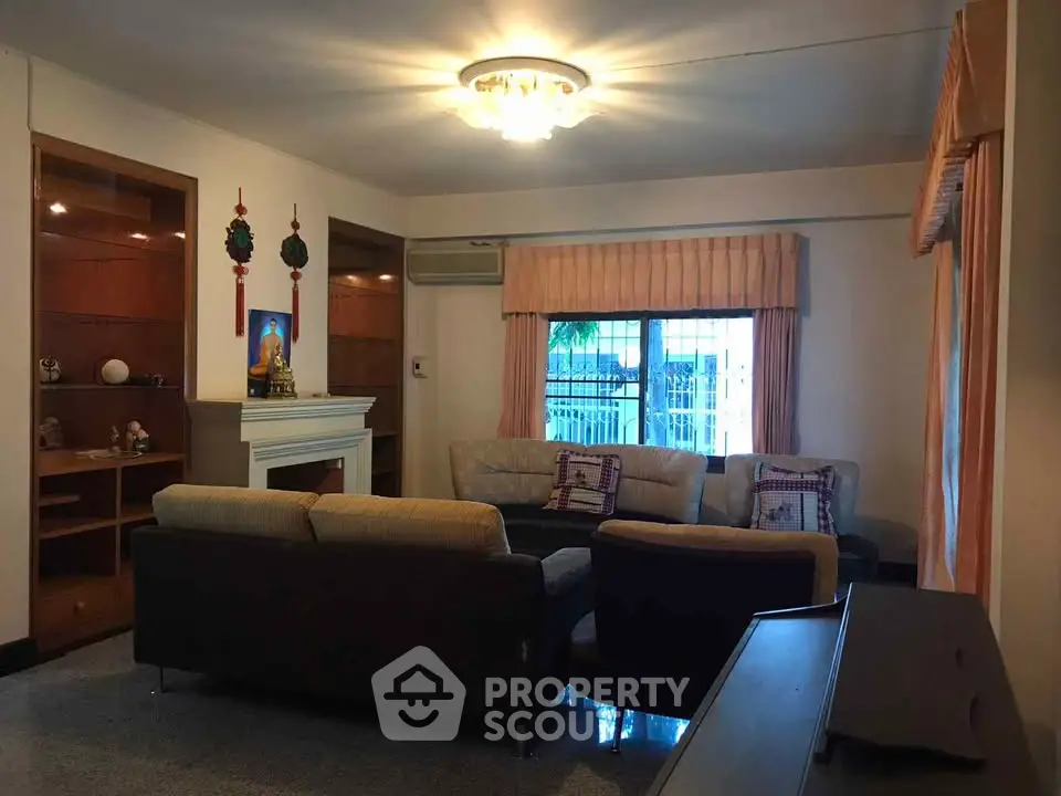 Cozy living room with elegant lighting and comfortable seating in a stylish home.