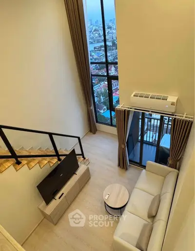 Modern loft living room with high ceiling and city view