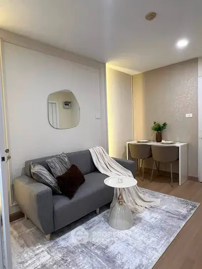 Modern living room with stylish decor and cozy seating area, perfect for relaxation and entertaining.