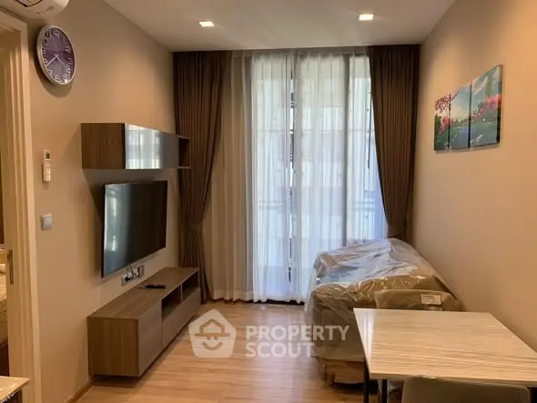 Modern living room with sleek TV unit and elegant decor