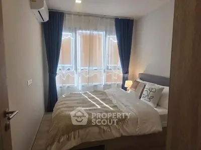 Cozy bedroom with natural light and modern decor