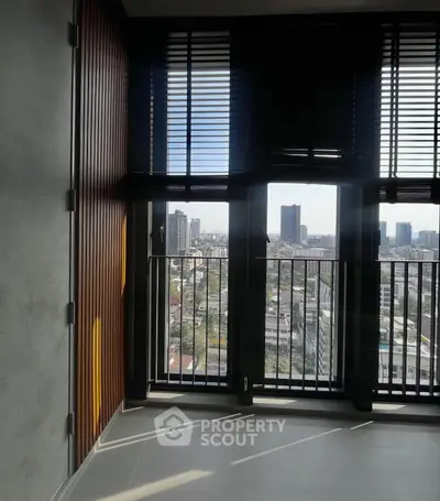 Modern apartment balcony with stunning city view and sleek design.