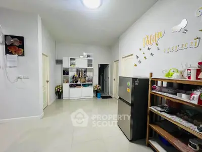 Spacious kitchen with modern fridge and ample storage space