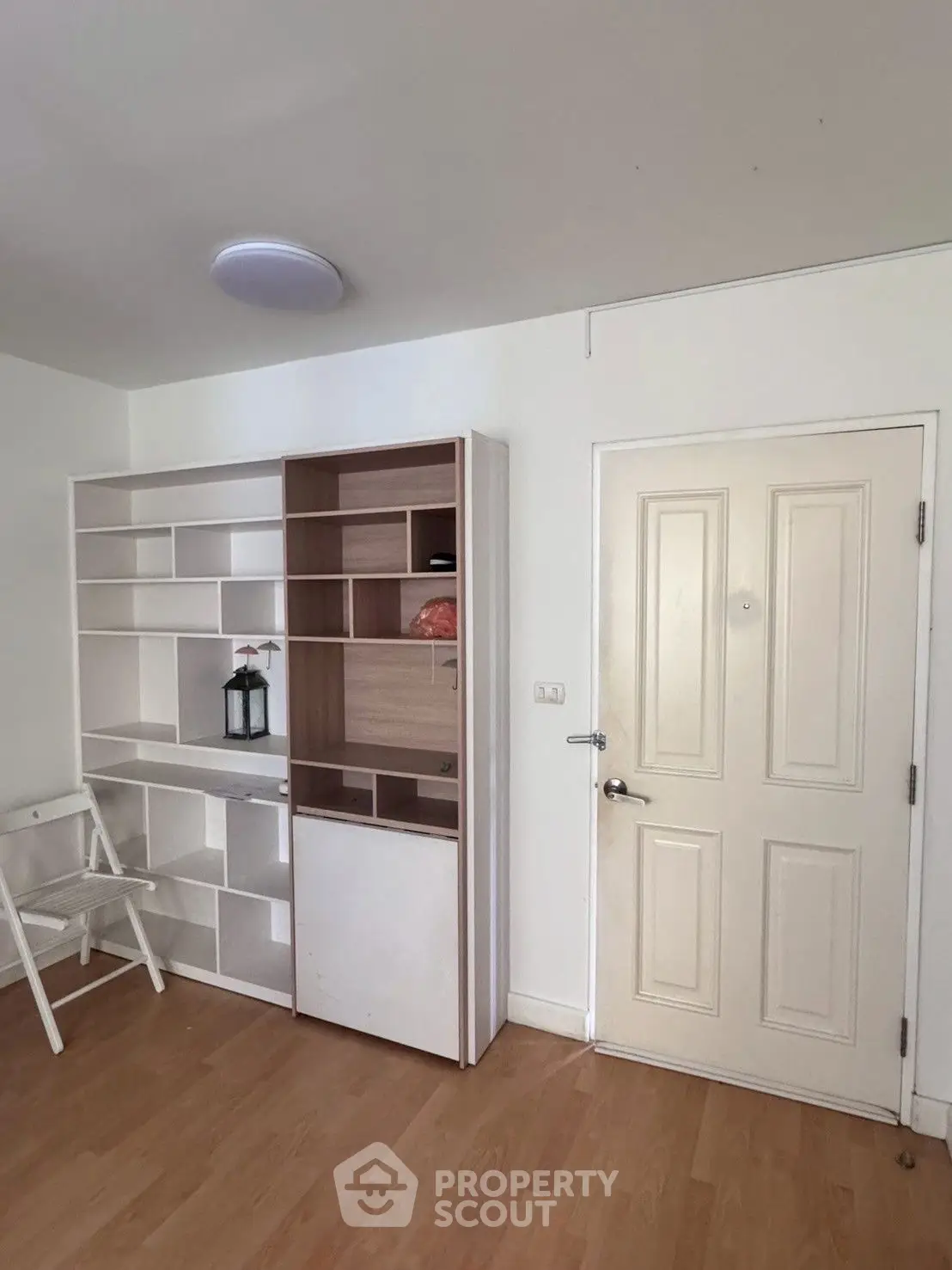 Modern interior with stylish shelving and wooden flooring