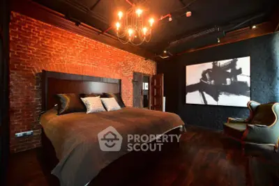 Luxurious bedroom with exposed brick walls and elegant lighting