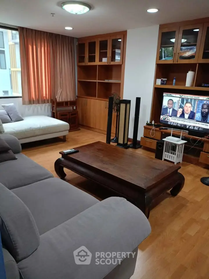 Spacious living room with modern furniture and entertainment setup