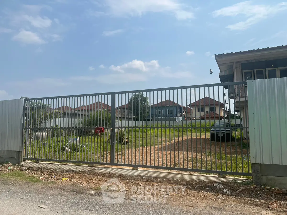 Spacious gated property with potential for development in a serene neighborhood.