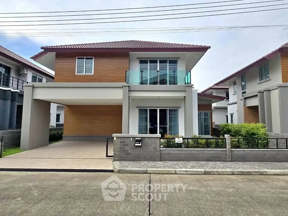 Modern two-story house with spacious driveway and stylish facade.